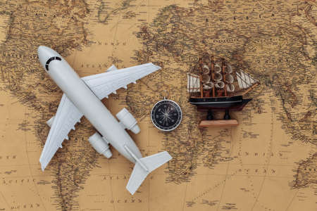 Compass and air plane, ship on old map. Travel, adventure conceptの写真素材