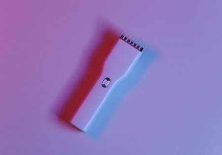 Hair clipper in blue-red neon lightの写真素材