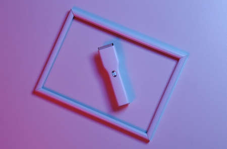 Hair clipper with frame in blue-red neon lightの写真素材