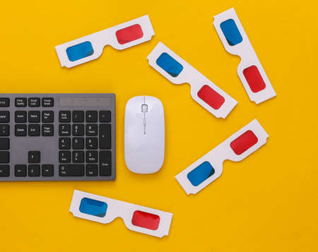 PC keyboard with 3d glasses on yellow background. entertainment. top view