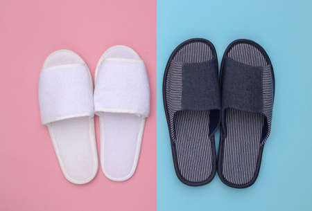 Sleeping room slippers on pink blue pastel background. top viewの写真素材