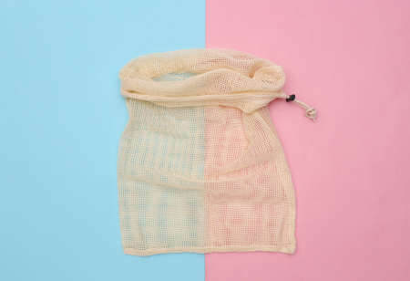 Eco cotton bag on pink blue pastel background. top viewの写真素材