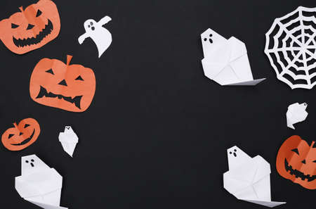 Handmade Halloween paper cut decor on Black background. Halloween background. copy spaceの写真素材