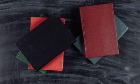 Books on a chalk board background. top view. back to schoolの写真素材