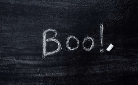Chalk Lettering Boo! on a chalk board. Halloween themeの写真素材