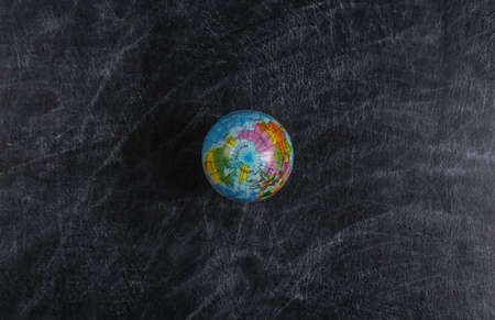 Globe on a school chalk board. Geography lesson. top view.の写真素材