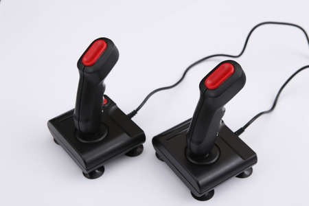 Two retro joysticks on white background. Gaming, video game competition. Top view, minimalismの写真素材