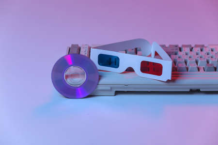 CD with, 3d glasses, old pc keyboard. Pink blue gradient neon, holographic light. retro waves....