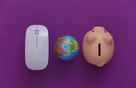 global network. Pc mouse and globe, piggy bank on purple background. Online business, shopping. top...