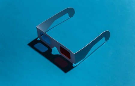 Anaglyph 3D glasses on a blue background with a shadow. pop art. 80sの写真素材