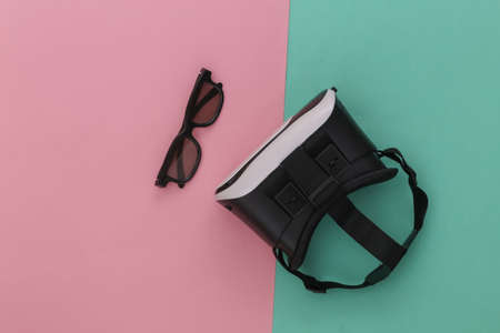 Virtual reality headset with 3D glasses on blue-pink background. top view. Fly layの写真素材