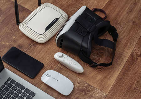 Modern youth gadgets and devices on wooden background.の写真素材