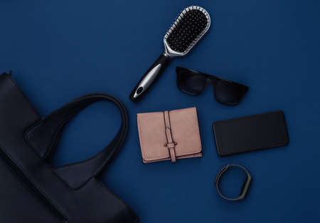 Women's fashion accessories on a classic blue background. Color 2020. Top view.の写真素材