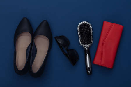 Women's fashion accessories on a classic blue background. Color 2020. Top view.の写真素材