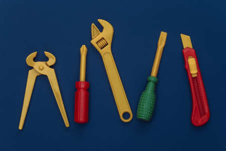 Toy work tools on a classic blue background. Color 2020の写真素材