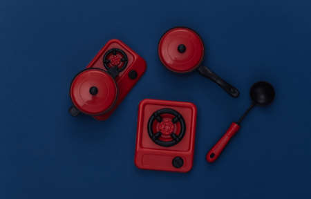 Toy kitchen utensils and tool on classic blue background. Color 2020の写真素材