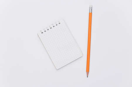 Notebook with pencil on white background. top viewの写真素材