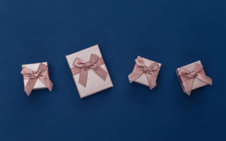 Gift boxes on classic blue background. Color 2020