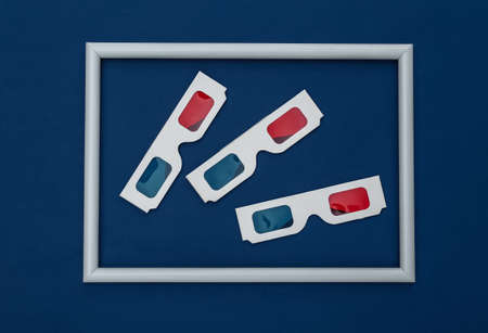 Anaglyph 3D glasses on classic blue background with white frame. Color 2020の写真素材