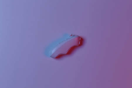 Modern joystick in blue pink neon light. top view