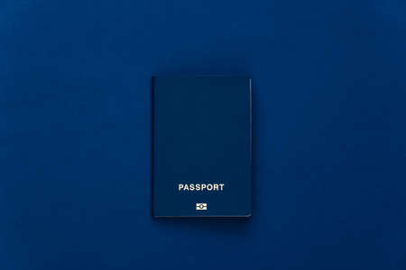 Passport on classic blue background. top viewの写真素材
