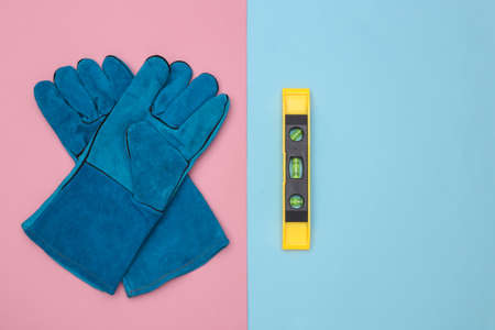 Work gloves, level on pink blue background. top viewの写真素材