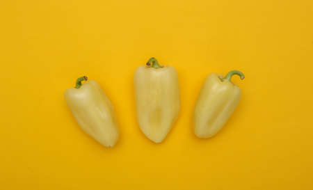 Bell peppers on yellow background. top viewの写真素材