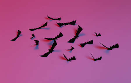 Flying paper cut bats in neon blue pink neon light. Halloween theme