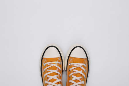 Retro sneakers (gumshoes) on white background. top view. copy spaceの写真素材