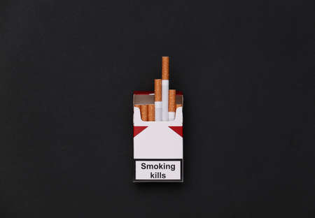 Pack of cigarettes on black background. smoking kills. top viewの写真素材