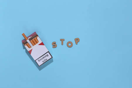 Stop smoking. Pack of cigarettes on blue backgroundの写真素材