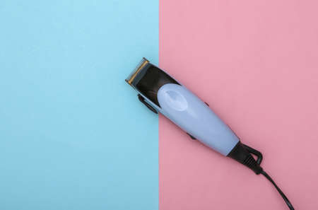 Hair clipper on a pink blue pastel background. top viewの写真素材