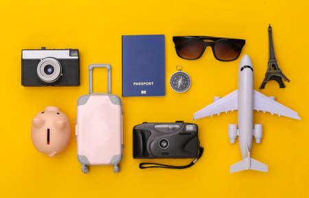 Travel flat lay. Travel accessories on yellow background. minimal style. top view