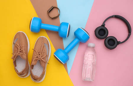 Flat lay composition sports and fitness accessories on colorful background. Ready for training. top viewの写真素材