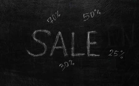 Sale word chalk hand drawn on blackboardの写真素材