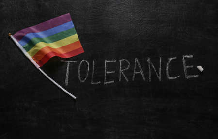 Lgbt rainbow flag and Tolerance word chalk hand drawn on blackboardの写真素材