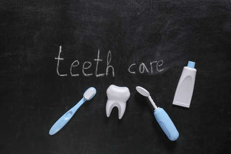 Dental care supplies and Words teeth care chalk hand drawn on blackboard
