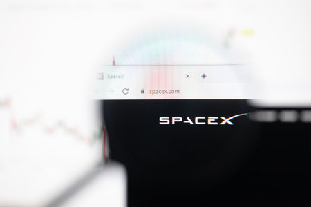 Odessa, Ukraine - December 17, 2020: Spacex website on monitor screen under magnifying glass.のeditorial素材