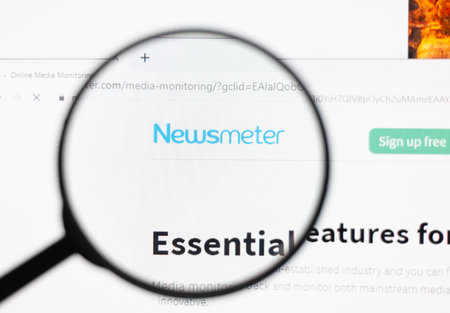 Odessa, Ukraine - December 17, 2020: Newsmeter website on monitor screen under magnifying glass.のeditorial素材