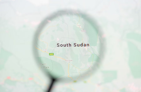 Odessa, Ukraine - December 17, 2020: South Sudan on google maps on the screen through a magnifying glassのeditorial素材
