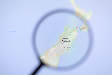 Odessa, Ukraine - December 17, 2020: New Zealand on google maps on the screen through a magnifying glassのeditorial素材
