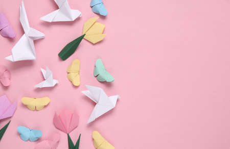 Spring composition of origami doves, butterflies, tulips on a pink background. copy spaceの写真素材