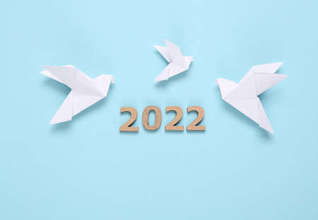 Origami doves and 2022 on blue background. peace symbolの写真素材