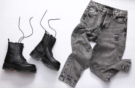 Women's clothing and accessories. Jeans and leather black shoes on a white background. top viewの写真素材
