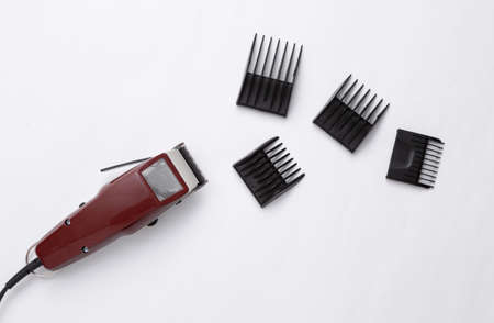 Machine for hairstyle. Barbershop. Hair clippers with nozzle isolated on white background.の写真素材