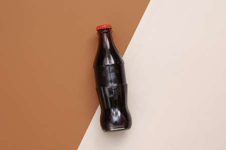 Soda bottle on beige brown background. top viewの写真素材