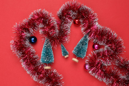 Christmas rain circle and christmas trees on red backgroundの写真素材