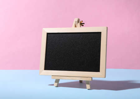 Empty chalk board on blue pink pastel backgroundの写真素材