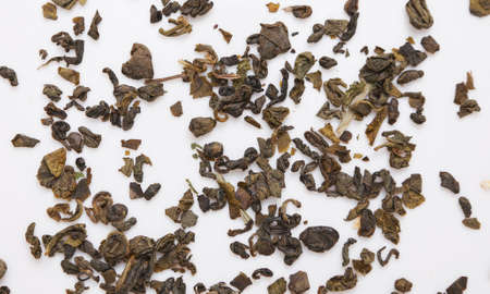 Green tea granules isolated on white backgroundの写真素材