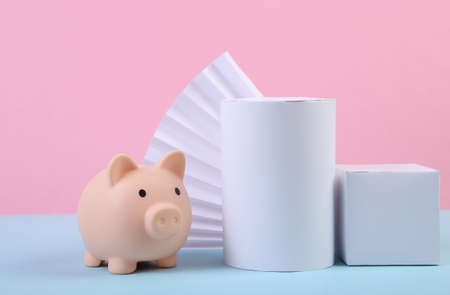 Piggy bank and geometric shapes on blue pink pastel background. minimalism. Abstract background,...